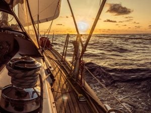 sailing into the sunset with full sails on the starboard side